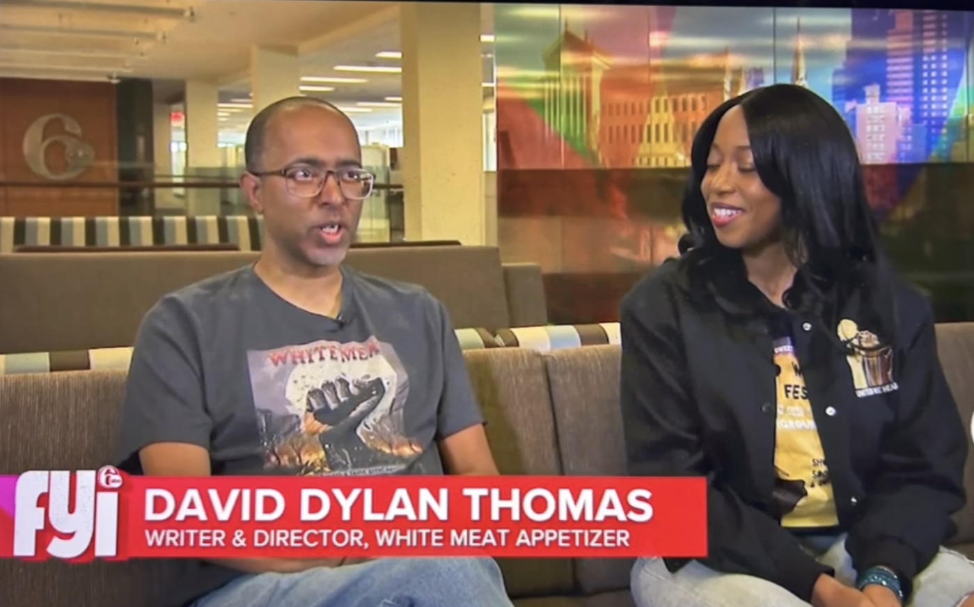 David Dylan Thomas on a couch with Ebony Roberts with a chiron with his name on it